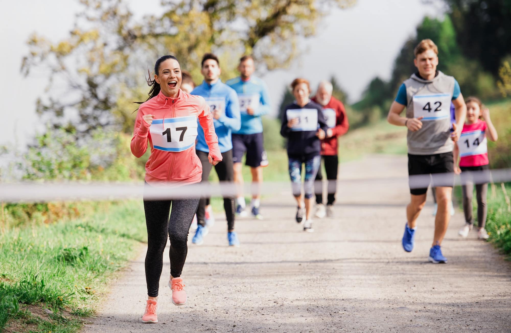 large-group-of-multi-generation-people-running-a-race-competition-in-nature.jpg